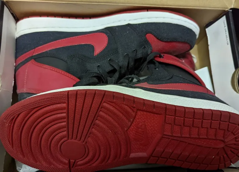 Air Jordan 1 AJKO Retro High Bred sneakers in black, varsity red, and white