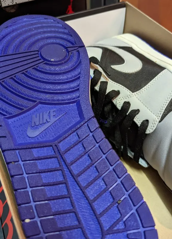 Air Jordan 1 Low sneakers in black, dark concord, and wolf grey