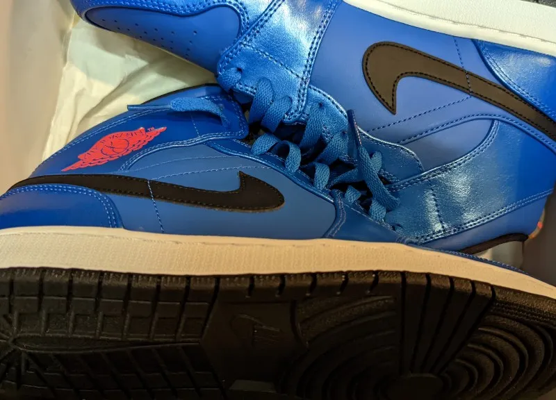 Air Jordan 1 Mid sneakers in sport blue, white, and black
