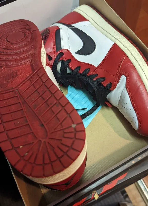 Air Jordan 1 Retro High Chicago sneakers in white, black, and varsity red