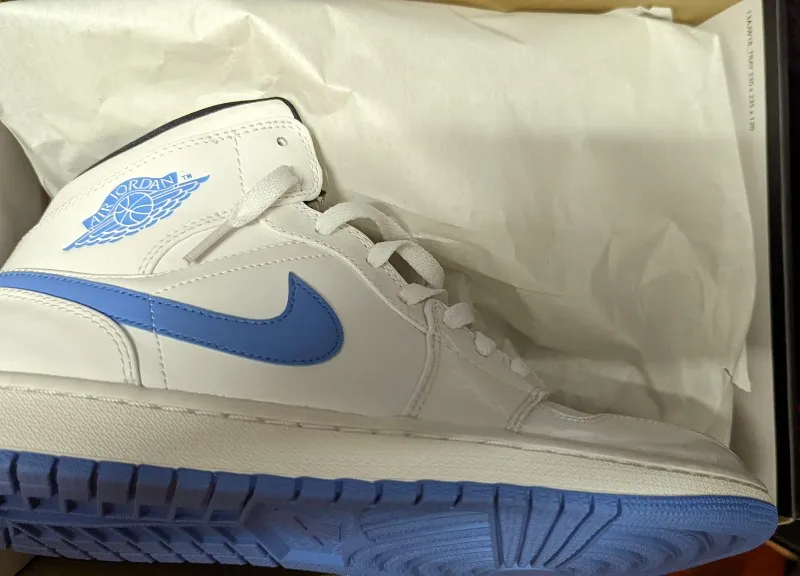Air Jordan 1 Retro Mid Legend Blue sneakers in white and legend blue