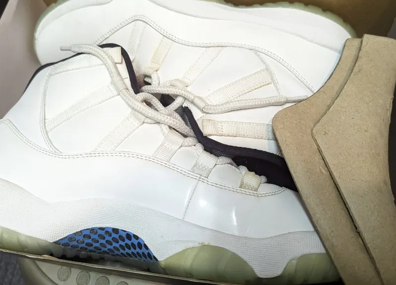 Air Jordan 11 Retro Legend Blue sneakers in white, legend blue, and black