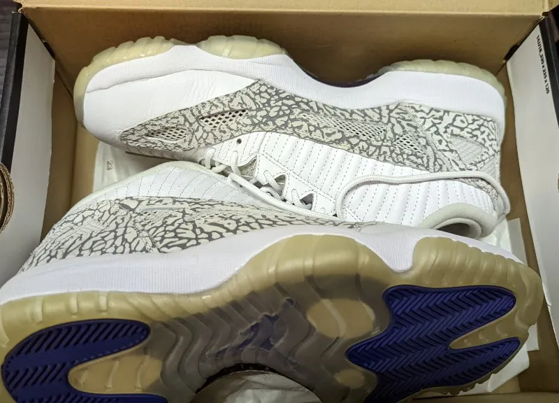 Air Jordan 11 Retro Low sneakers in white, cobalt, zen grey, and cement grey