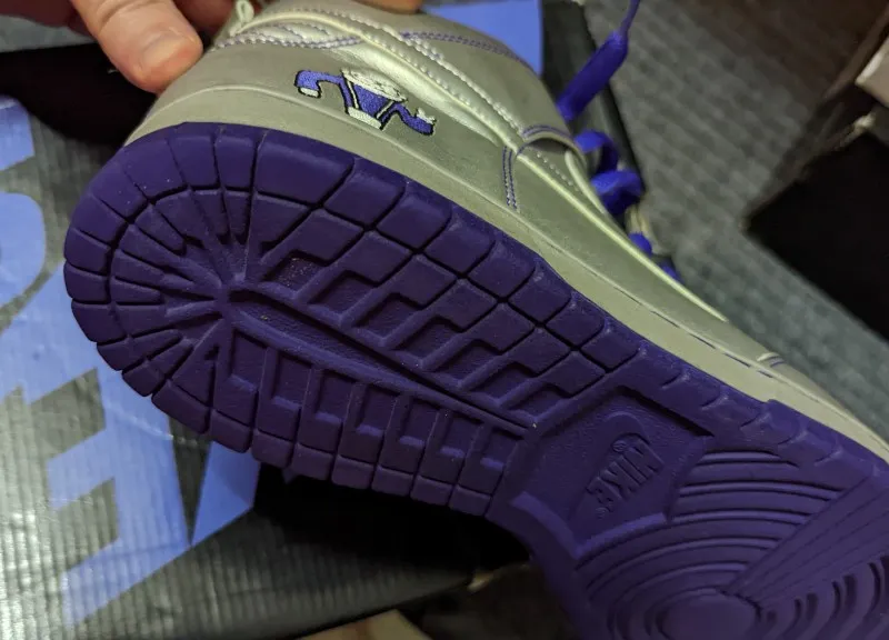 Nike Dunk High Premium SB Dinosaur Jr sneakers in metallic silver and purple